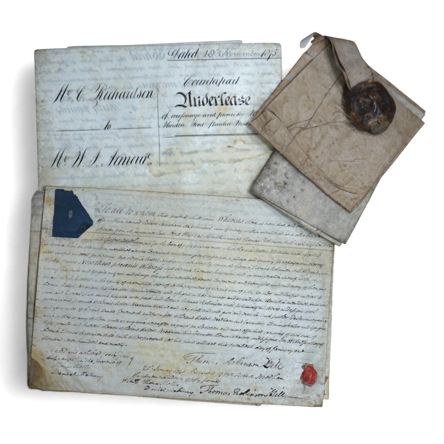 Four indentures to include an Elizabethan parchment indenture, 1603 parchment document with seal, another with a seal and two later 19th century. Condition - all worn and stained as expected with age